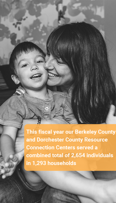 image of woman and young boy smiling in black and white. has caption "this fiscal year our berkeley county and dorchester county resource connection centers served a combined total of 2654 individuals in 1293 households