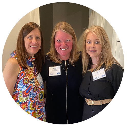 3 WOMEN UNITED members smiling at camera