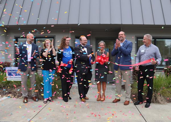 A group of TUW supporters, board members and employees celebrate the opening of another Resource Connection Center