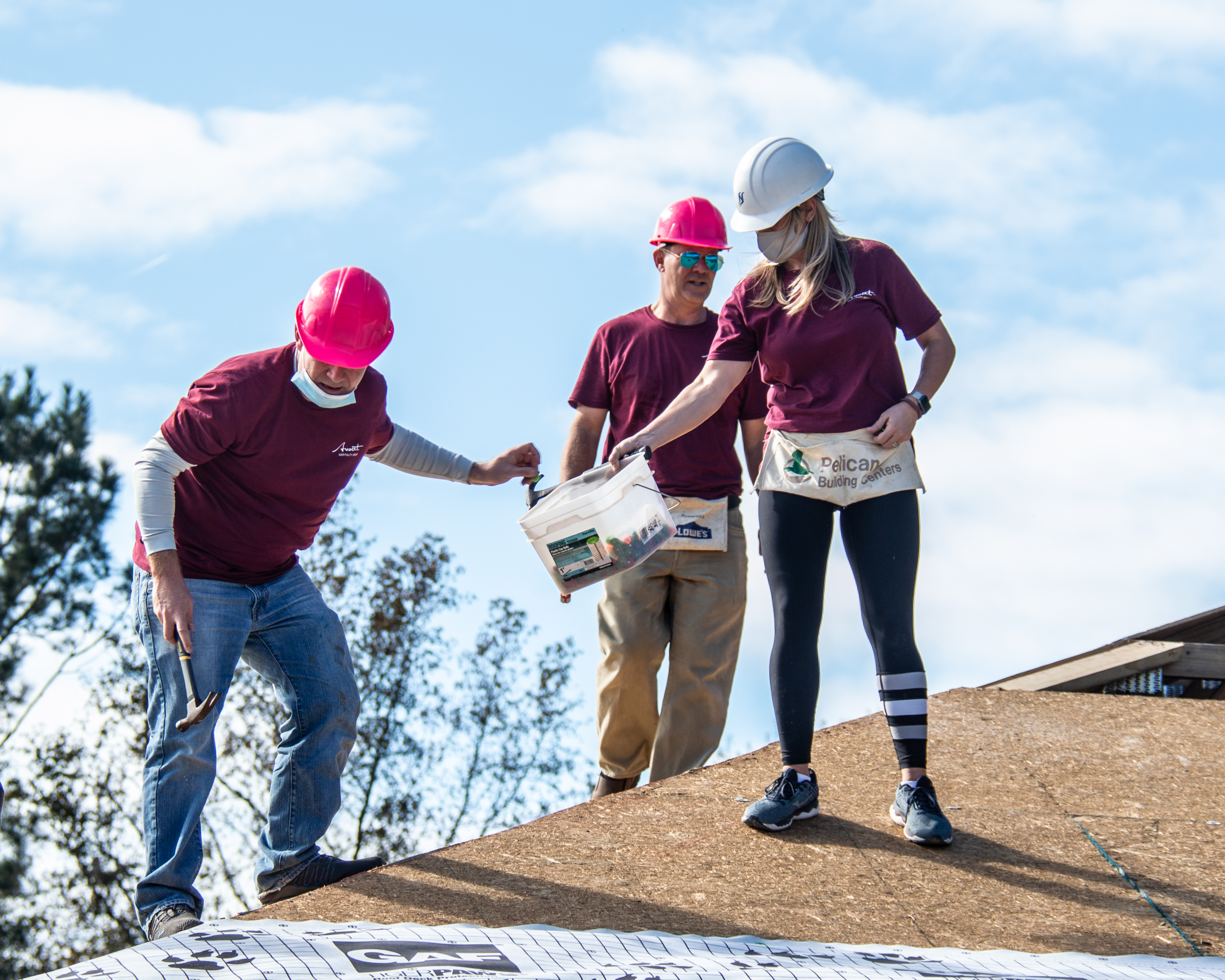 Avocet Hospitality volunteers working on a house