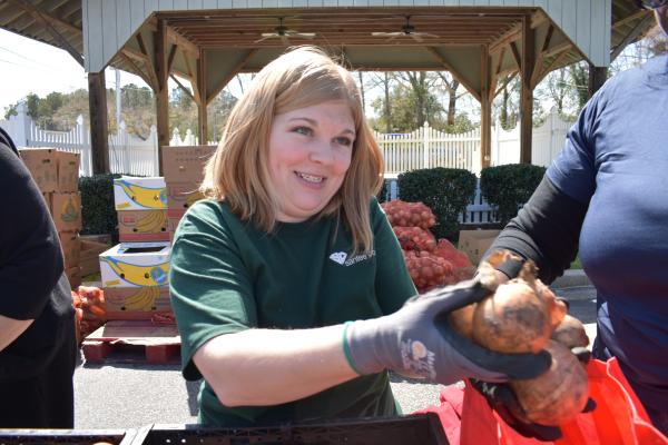 volunteer handing someone food