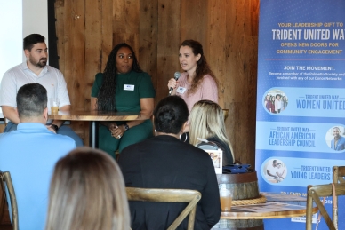 Photo of Lunch and Lead panelists Joey Current, Latoya Lewis and Torie Gardner. Torie is speaking into a microphone.