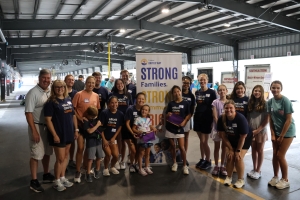 Photo of a group of individuals from Elliott Davis posing for a photo at the backpacking event