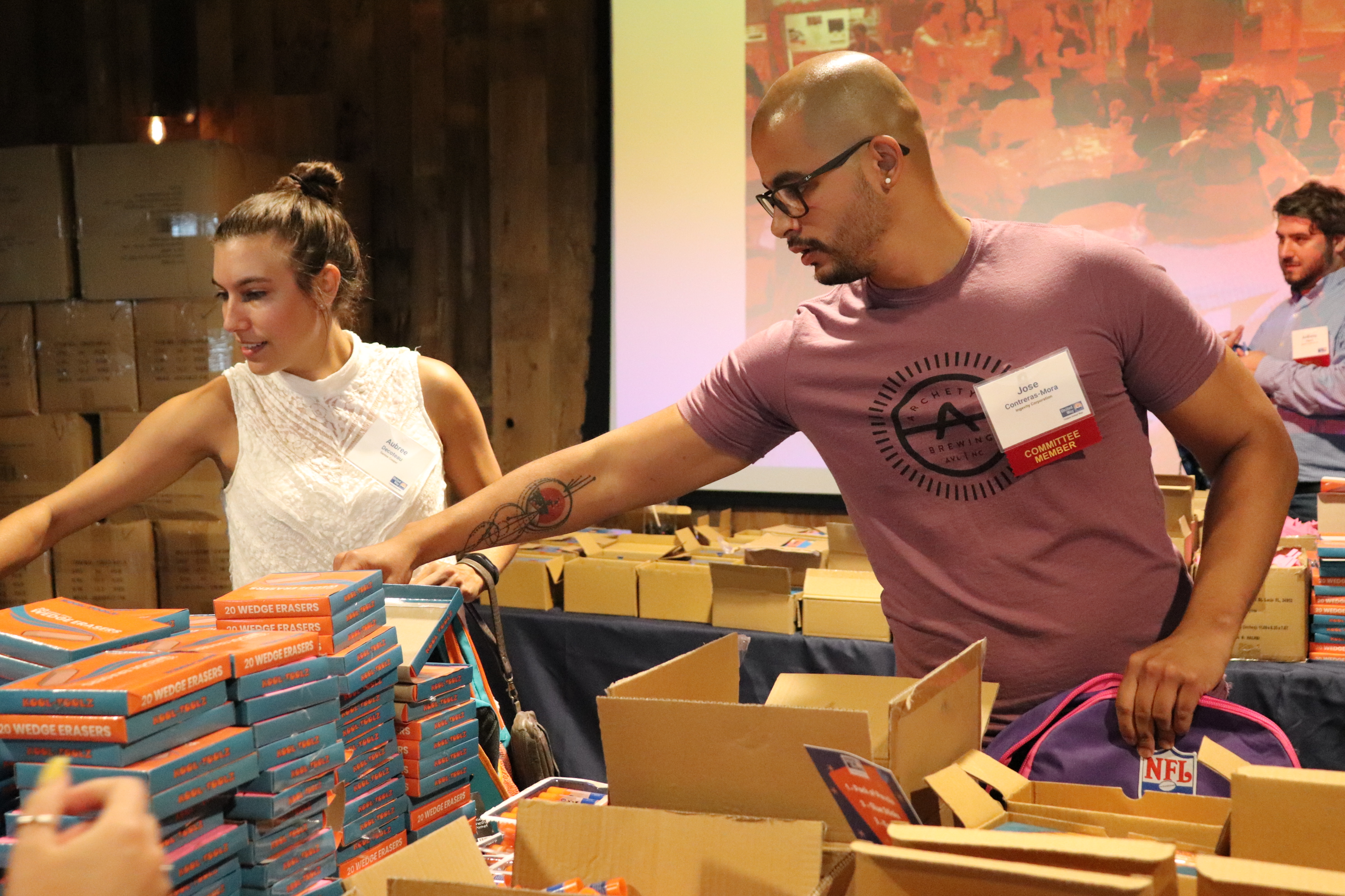 volunteers packing backpacks