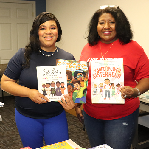 Members of the African American Leadership Council holding books