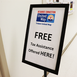 A stand up sign outside of the Dorchester Resource Connection Center that says free tax filing assisntace offered here!