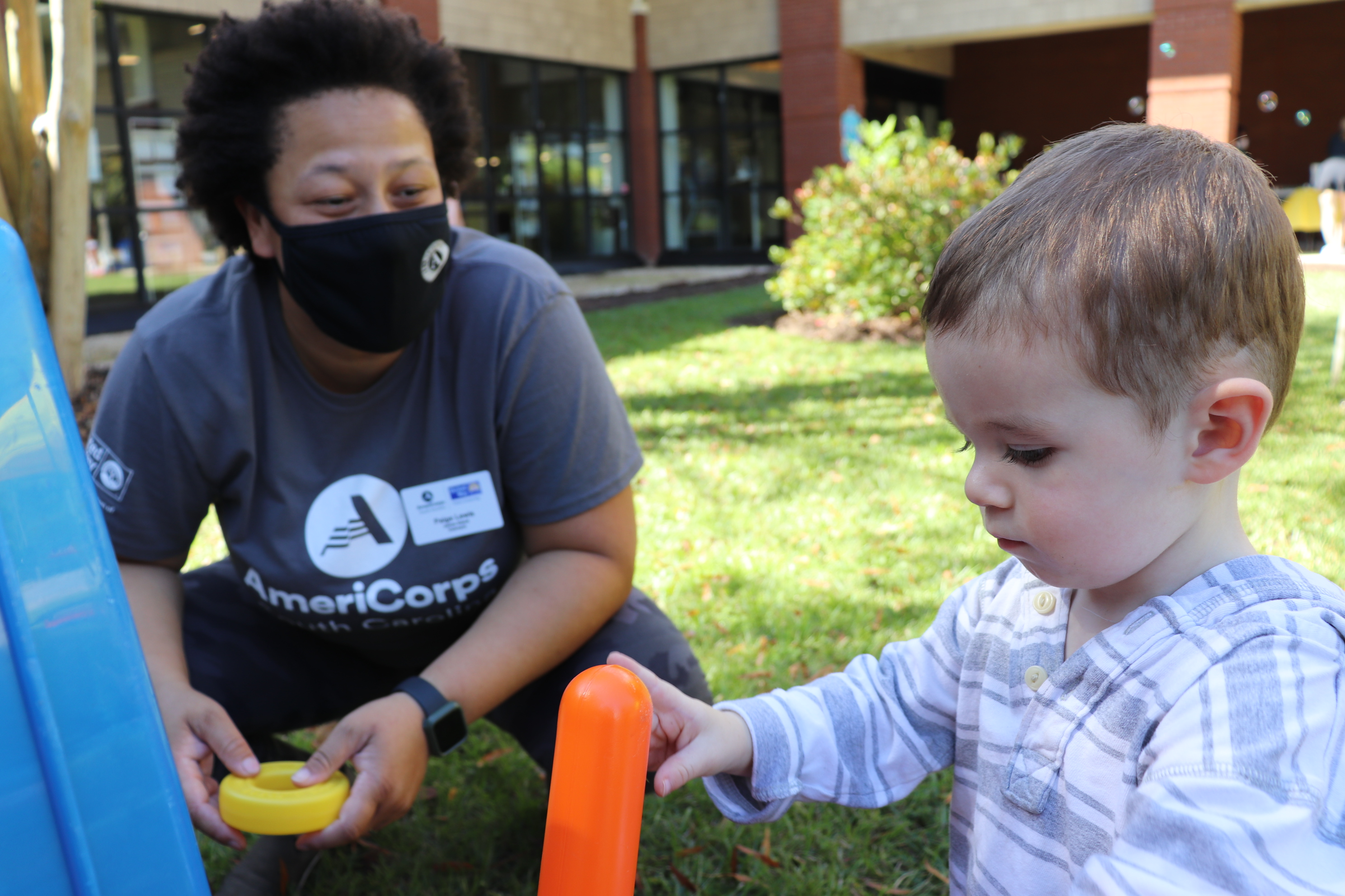 AmeriCorps member with kid