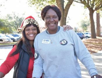 Jakki Deas and Brenda Williams smiling at camera