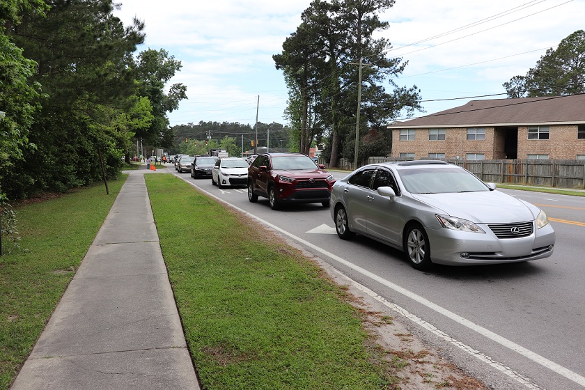 Cars lined up on Boonehill Road, waiting to get into the Fresh For All event