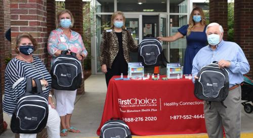 Select Health donates backpacks to Midland Park school, pictured with Chloe Knight Tonney and Mayor Keith Summey