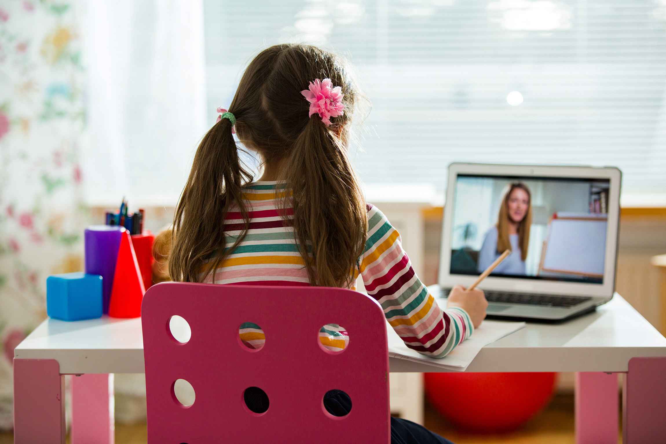 girl sitting at her computer doing work