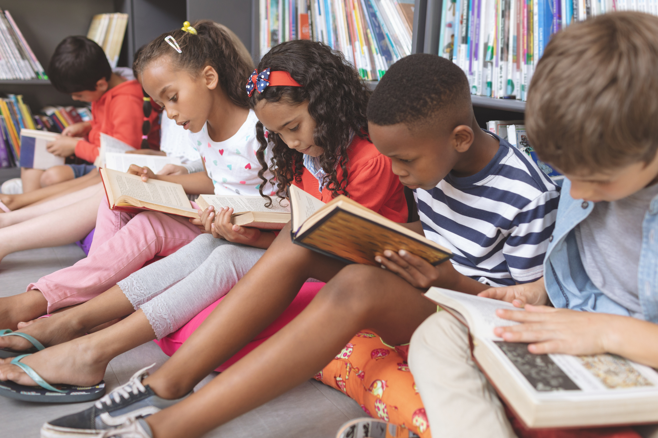 group of kids reading in library