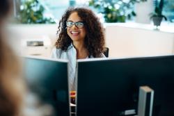 Photo of a smiling woman working office reception