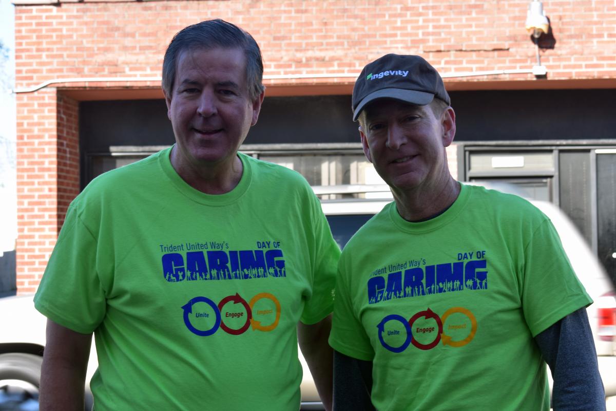 two day of caring volunteers smiling