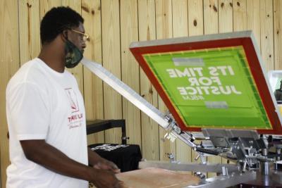 Turing Leaf participant making a shirt