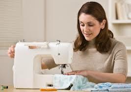 Photo of a woman sewing a clothing item with a sewing machine