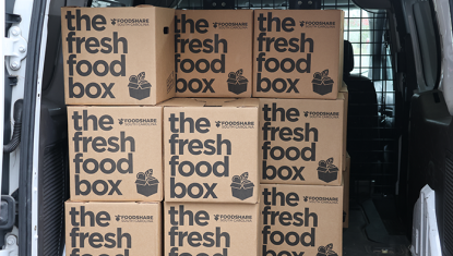 FoodShare boxes in the back of a delivery truck to be sent out to families and households in need.