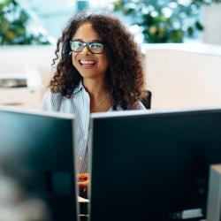 Photo of a smiling woman working office reception