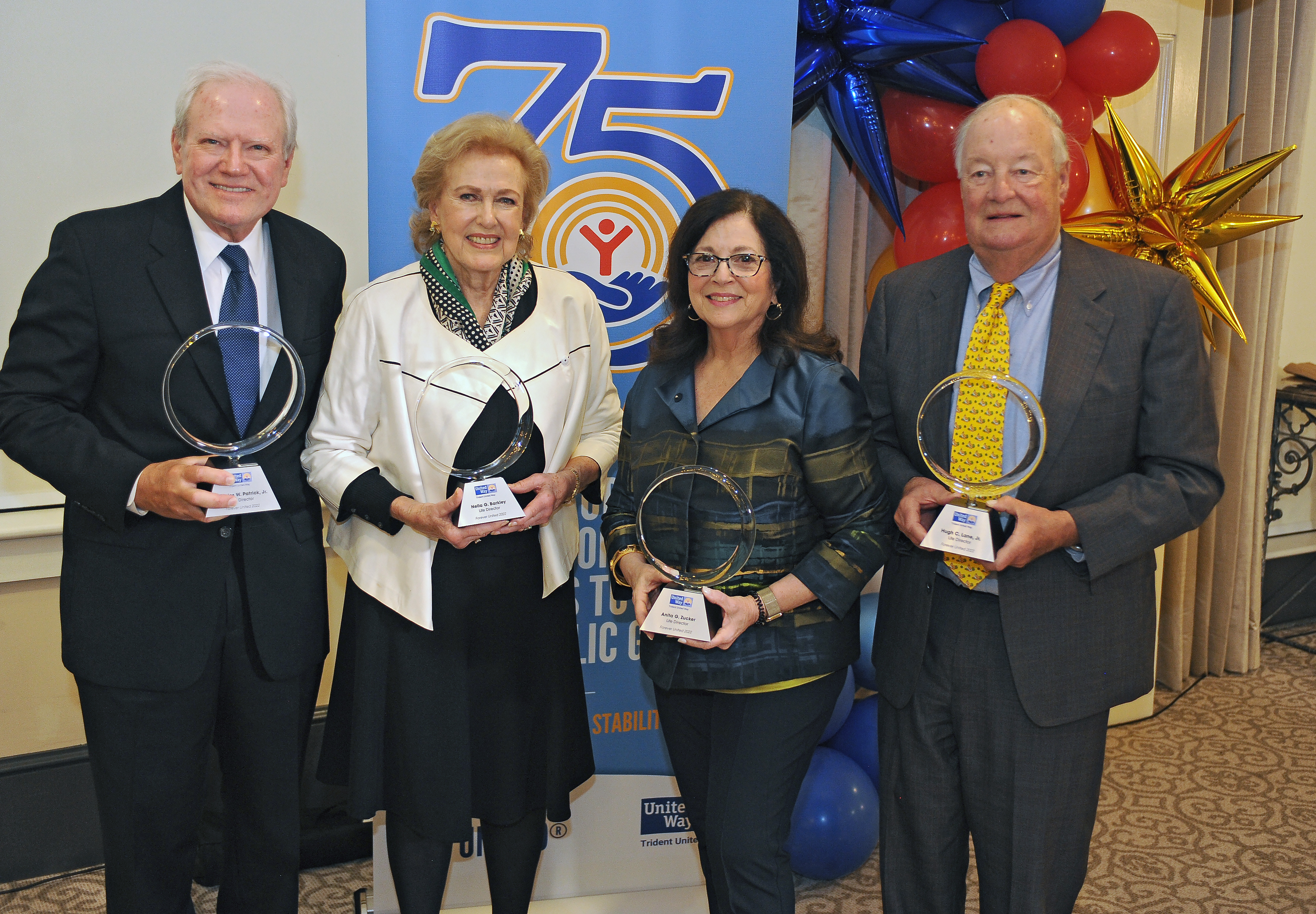 Photo of the four Life Directors holding award - Charles Patrick, Jr., Nella Barkley, Anita Zucker and Hugh Lane, Jr.