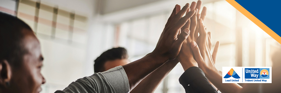 Lead United website banner showing diverse group of individuals high-fiving in front of sunkissed windows