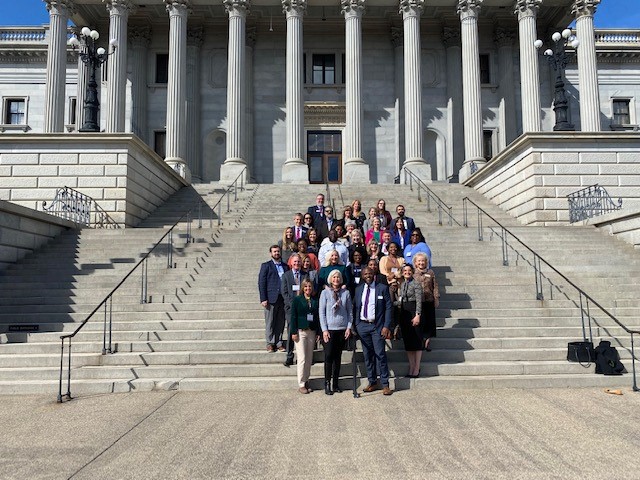 UWASC group standing outside the state capital